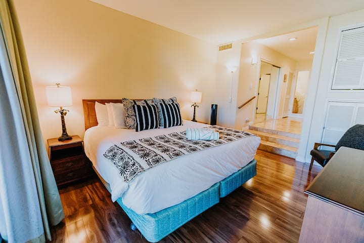 Master bedroom has a king size bed, lanai access, flat screen tv, dressing area and en suite bathroom.