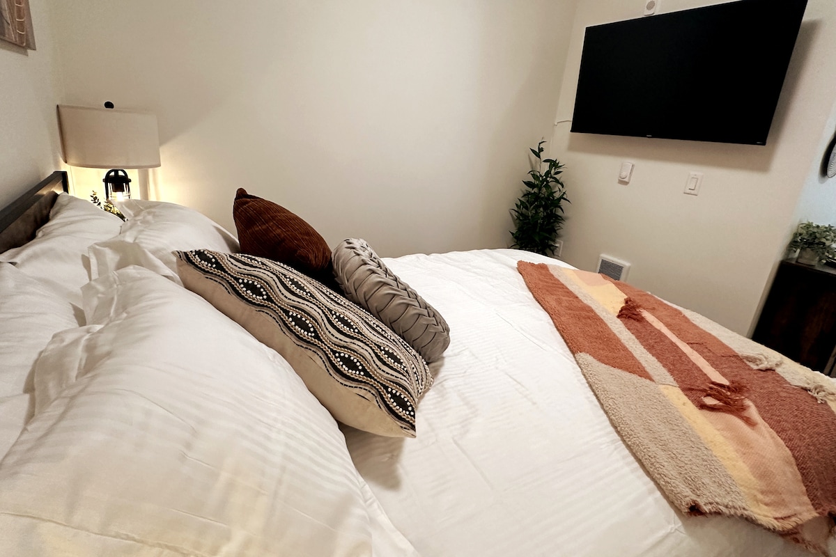 A 50" Smart TV for streaming all your favorite shows and a remote-controlled tower fan, sound machine, plenty of outlets and USB charging ports are also some of the amenities provided for your comfort in the bedroom.