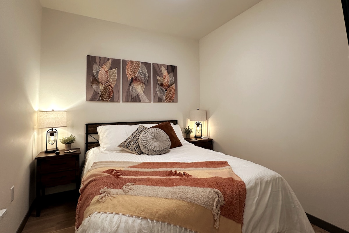 Comfortable queen memory-foam bed with luxurious linens, a down comforter, and a noise machine for added convenience.