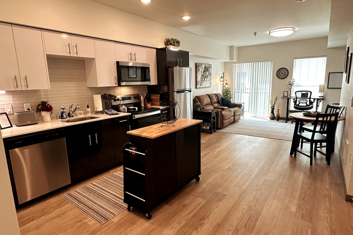 “Welcome in! Open-concept kitchen and living area with a bright, comfortable layout.”