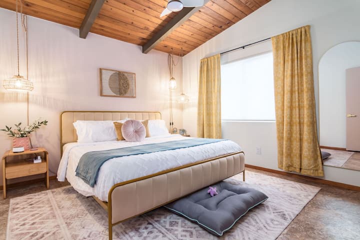 The primary bedroom features a king size bed and a Nectar brand memory foam mattress. 2 dog beds are available for your fur babies. Each bedside table includes a power strip with USB ports and a wireless charger. 