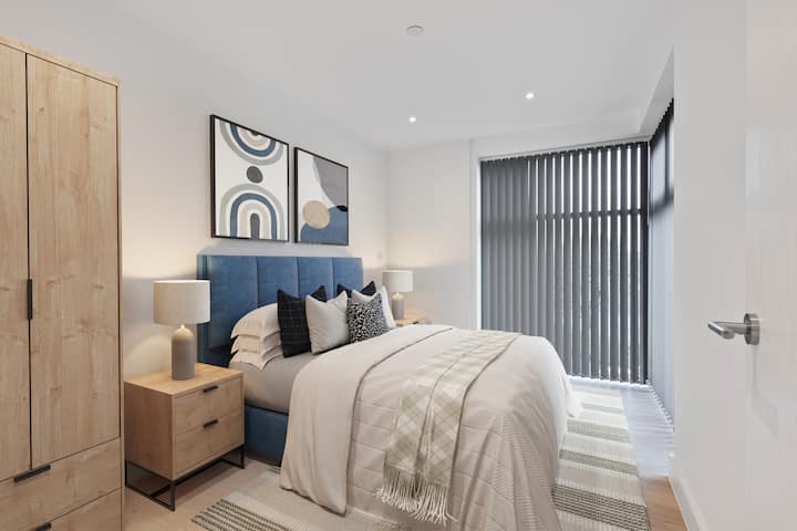 Unwind in this well-appointed bedroom, featuring quality linens and a relaxing atmosphere.