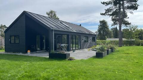 Modern and cozy cottage near the water