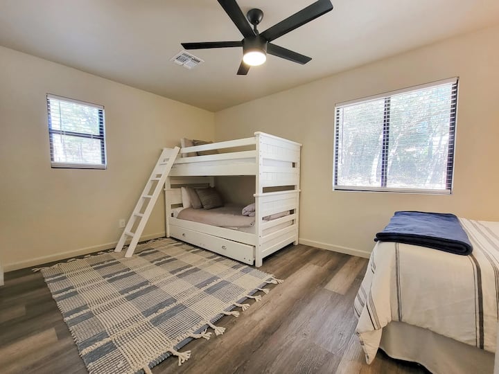 Second bedroom with queen-sized bed and bunk bed with trundle.