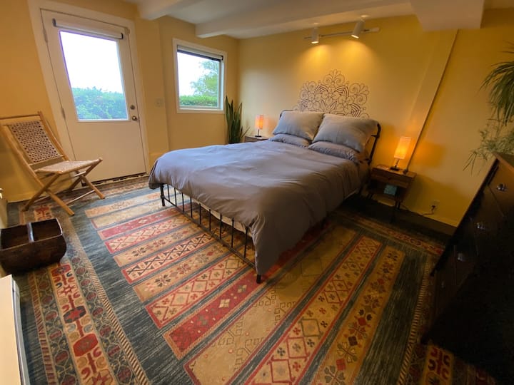 Bedroom 2. Has separate entry, and ocean and mountain views.