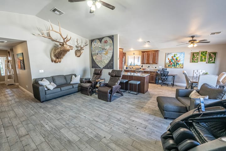 Enjoy relaxing in your he living room with zero gravity recliners, massage chair, water features and an 80” Oled TV. 