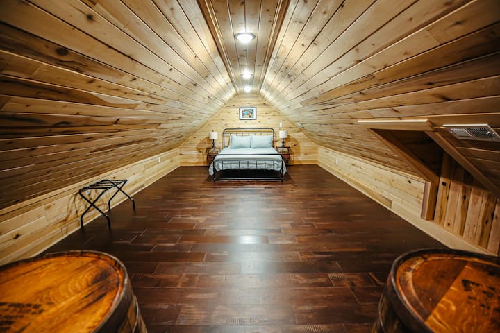 Queen bed in loft just up spiral stairs in living room-not completely private see living room pictures