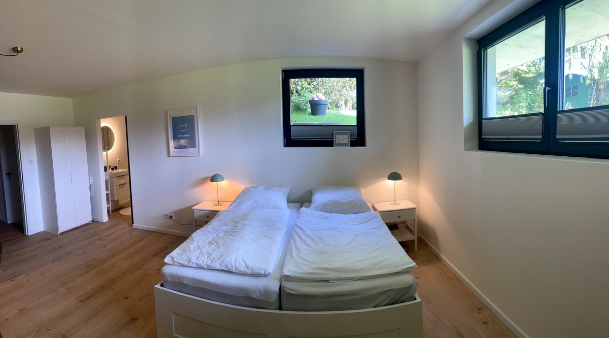 The apartment is bright and friendly and you can look into the garden from both windows.