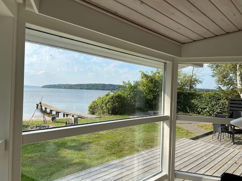 Cottage with its own sandy beach and jetty at Mossø