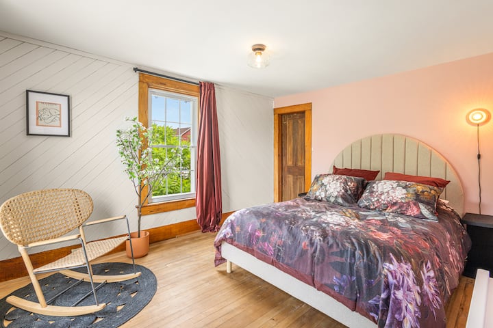 2nd floor, master bedroom with queen-size bed and walk-in closet (front-facing, village view)
