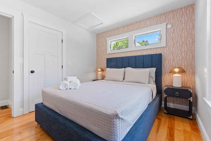 Queen sized bed ready to greet you for a full night's rest after a day filled of activities.