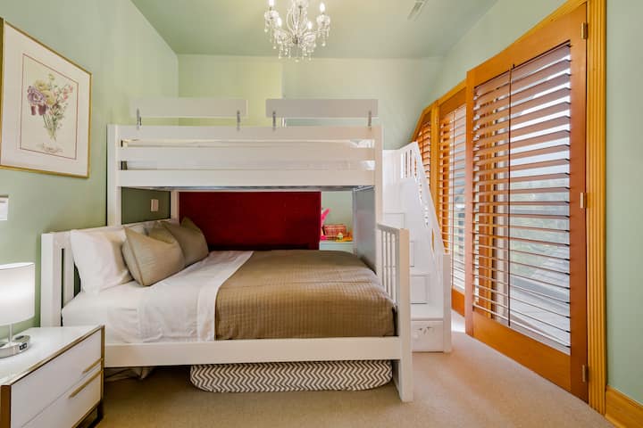 Bunk bed with a queen on the bottom and twin on the top, Smart TV, and private balcony with an ensuite bathroom with a bathtub. 