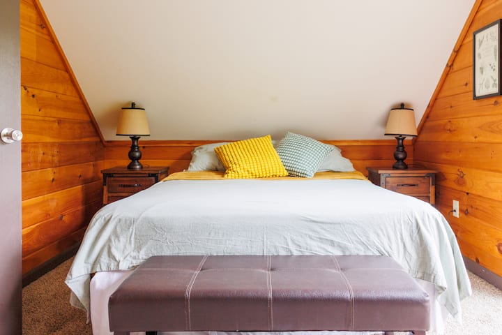 Bedroom #3 with queen bed and balcony overlooking Lily Pad Pond