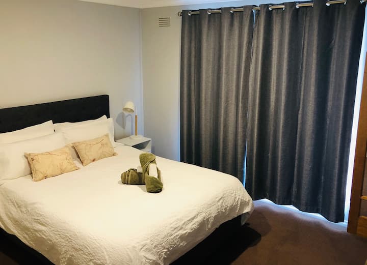 Spacious master bedroom with queen size bed