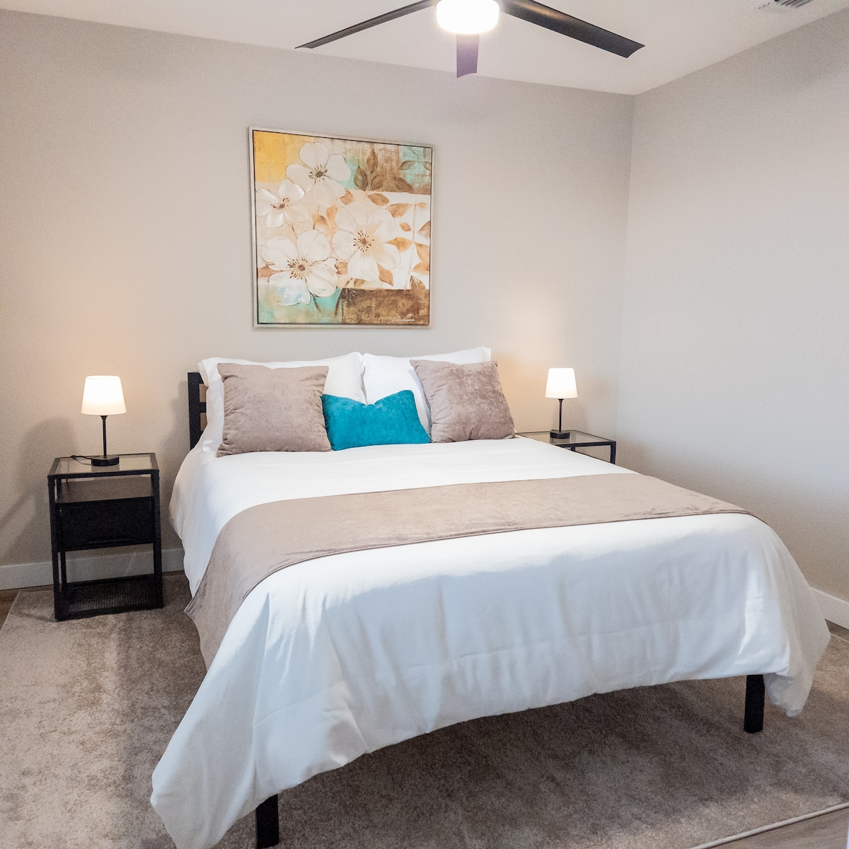 Bedroom #3 - Clean lines, monochrome color scheme, pops of bold color with artwork and throw pillows.