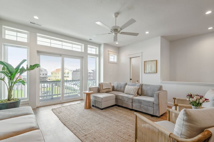 Boho luxury at its finest—this bright and airy living room sets the tone for a tranquil, stylish retreat just steps from the beach
