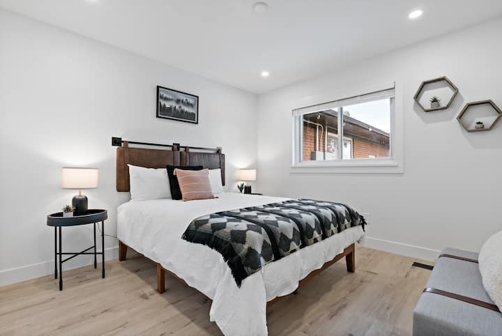 Main level bedroom features queen size bed which sleeps 2 people comfortably.