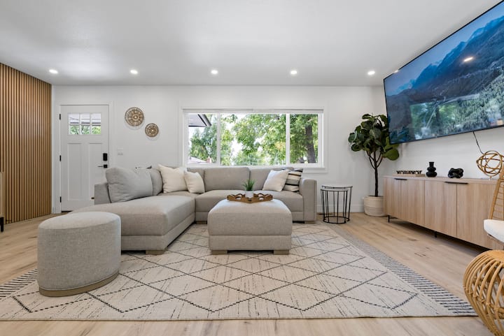 Sink into the huge sectional and indulge in your favorite movies and shows on the 75” smart TV.