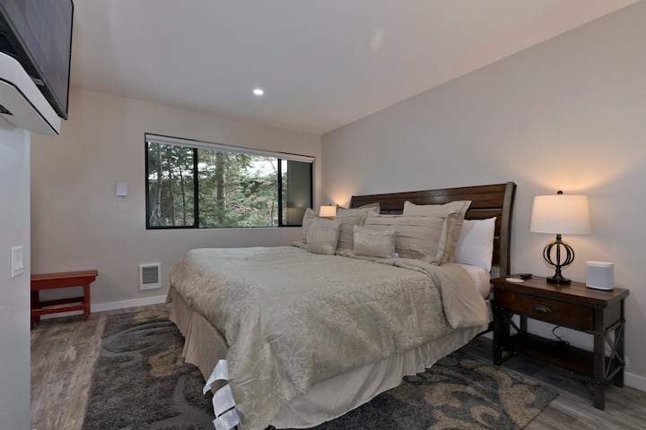 Master bedroom has a king size bed.