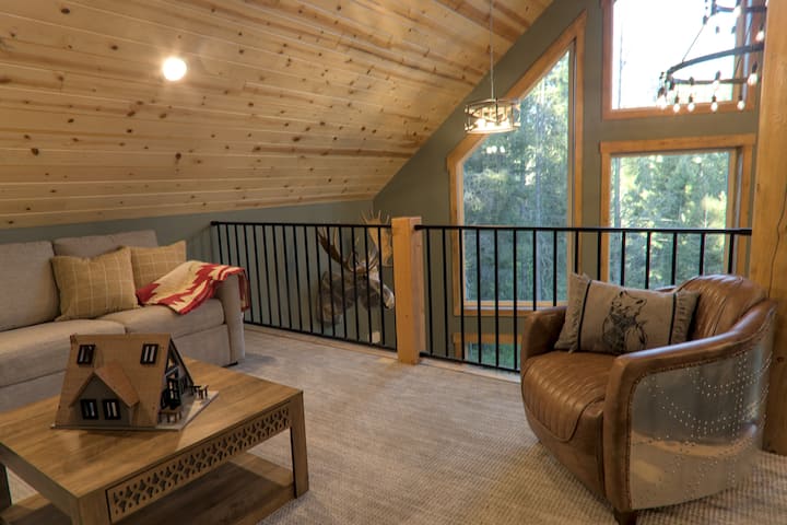 Loft room with children's toys and relaxing area. Also a pull out couch to sleep on.