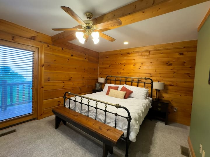 The main floor "Eagle Suite" has a King bed, balcony access, Smart TV, and an en suite full bath with shower and sunken tub.