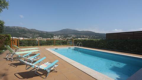 House with a pool on the Miño River
