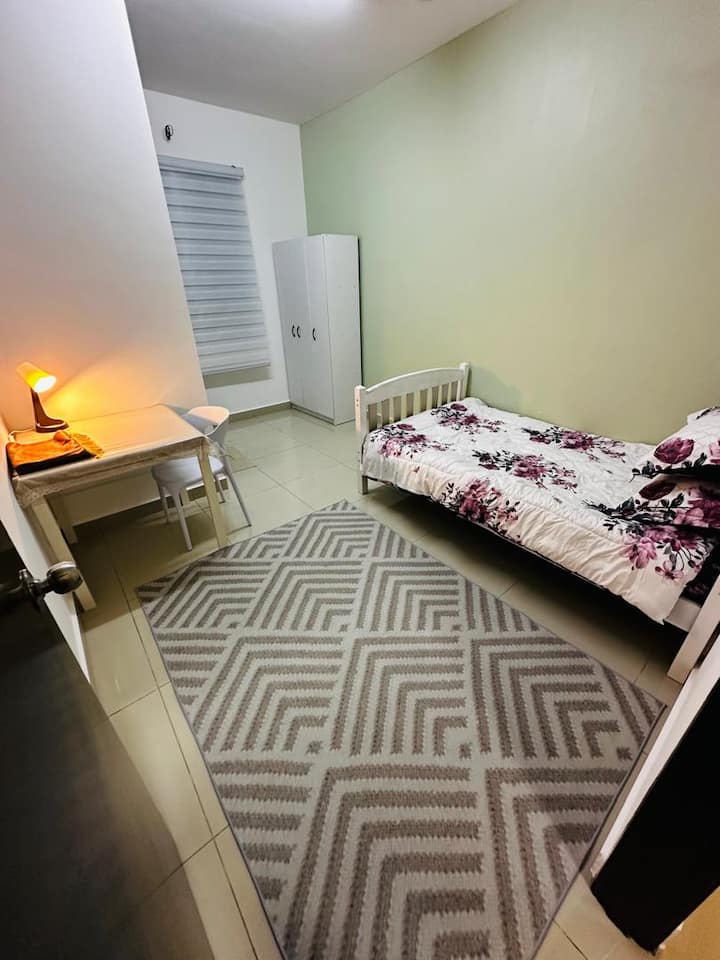 The room is suitable for the guest's child. Simple and cozy decor. Also equipped with table and chairs