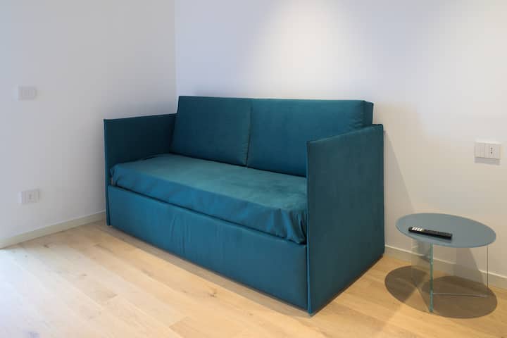 ห้องนอนพร้อมเตียงโซฟา 