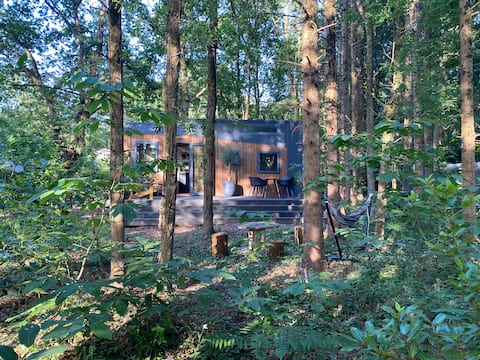 Tiny house on wooded land 10 minutes from the sea