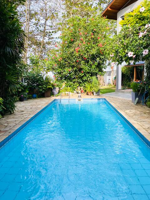 A beachfront spot with a swimming pool.