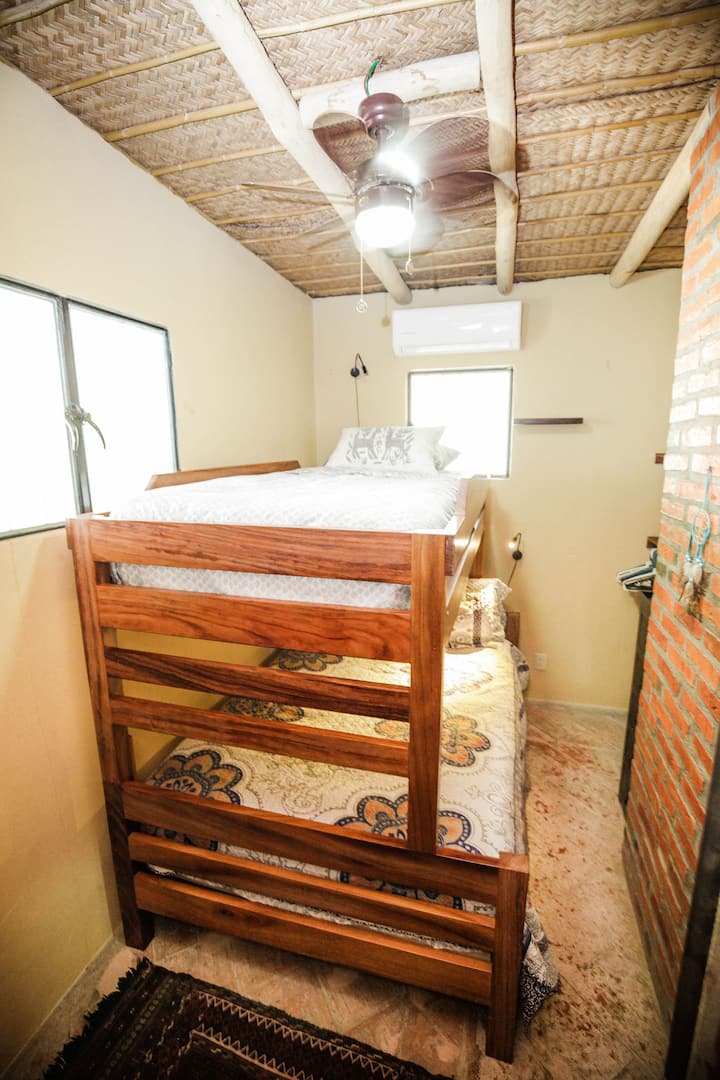 Second bedroom has a bunkbed, with the full size bed below and a twin above. 