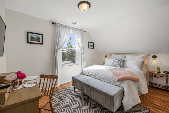 A work space and a view of the pond in the Millstone Suite