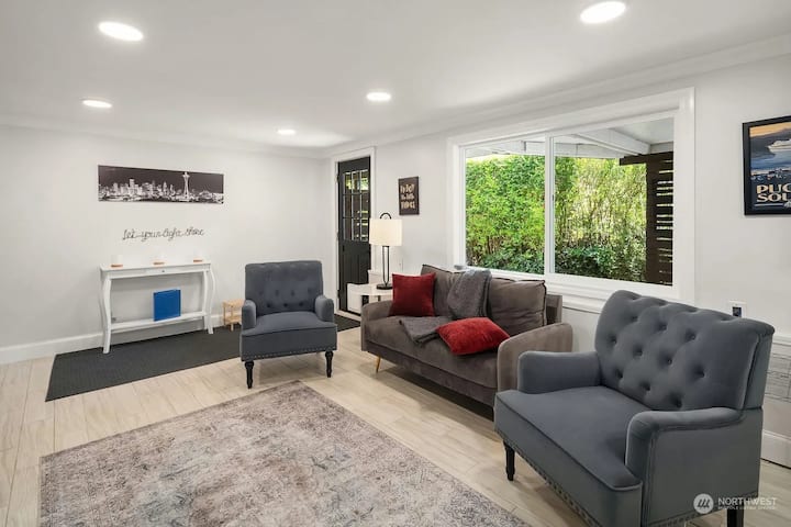 Basement living room with private entrance, heated floors, natural light.
The sofa is adjustable and can be flattened down to a single bed.