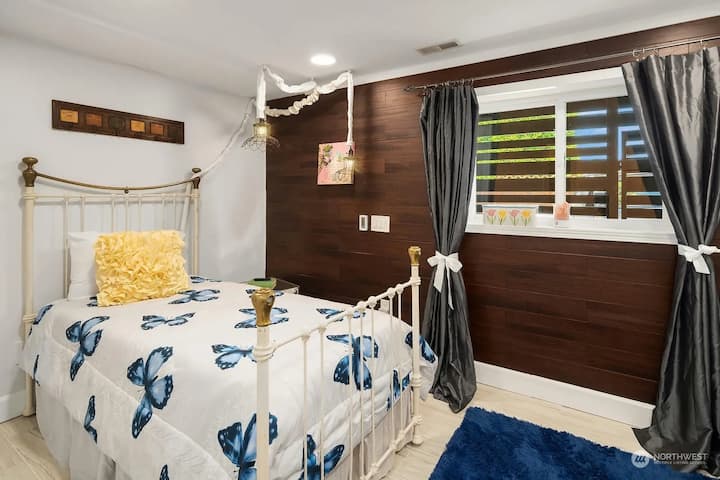 Electronic adjustable bed with a closet and TV with Google Chromecast.