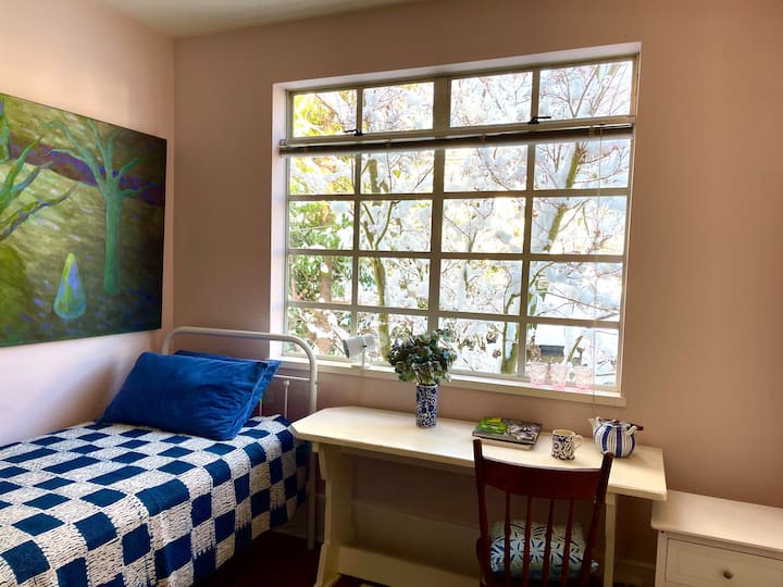 Single bed. Lovely view looking out into the garden. Great place to relax with a book and a cup of tea.