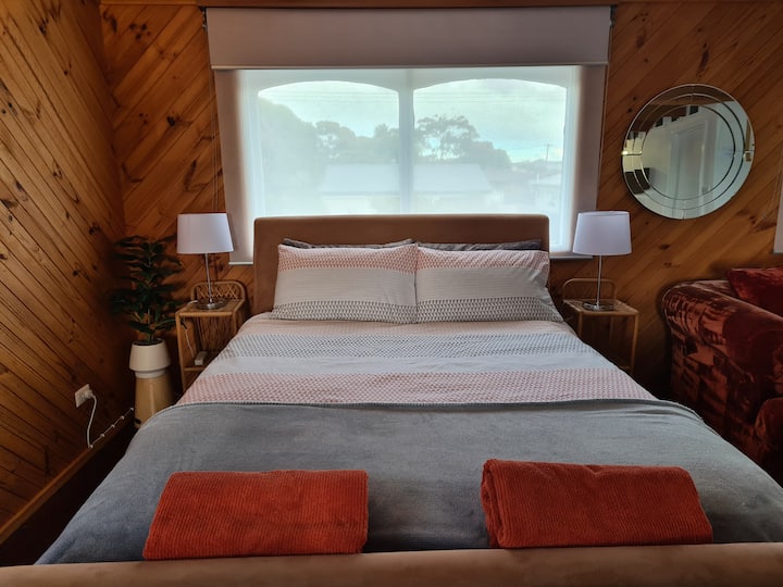 QS Bed with towels, electric blanket, and USB charging power boards to recharge devices.