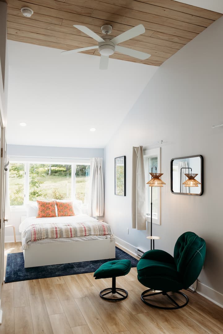 Bedroom with a Queen bed, day bed (that expands to a queen) and a lounge chair to catch up on all your reading & deer spotting