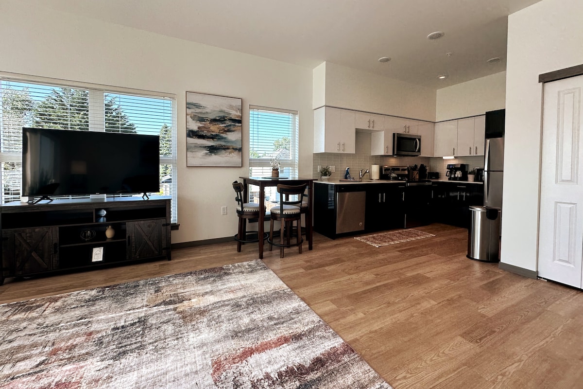 You will find a 55" Smart TV for streaming all your favorite shows in the living room.