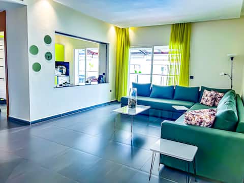Top performing Airbnb: Family living room with panoramic sea and pool view in Soualem Trifiya
