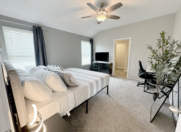 Master bedroom has a workspace and 4K Smart TV