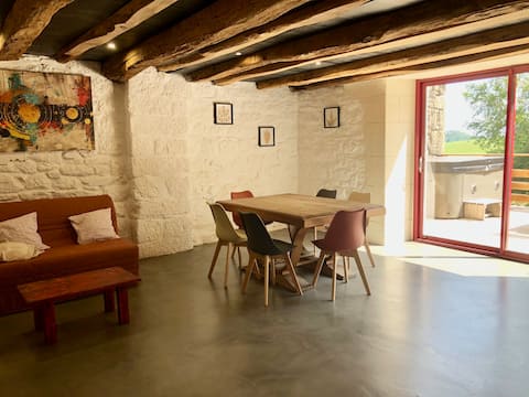 House surrounded by nature with hot tub