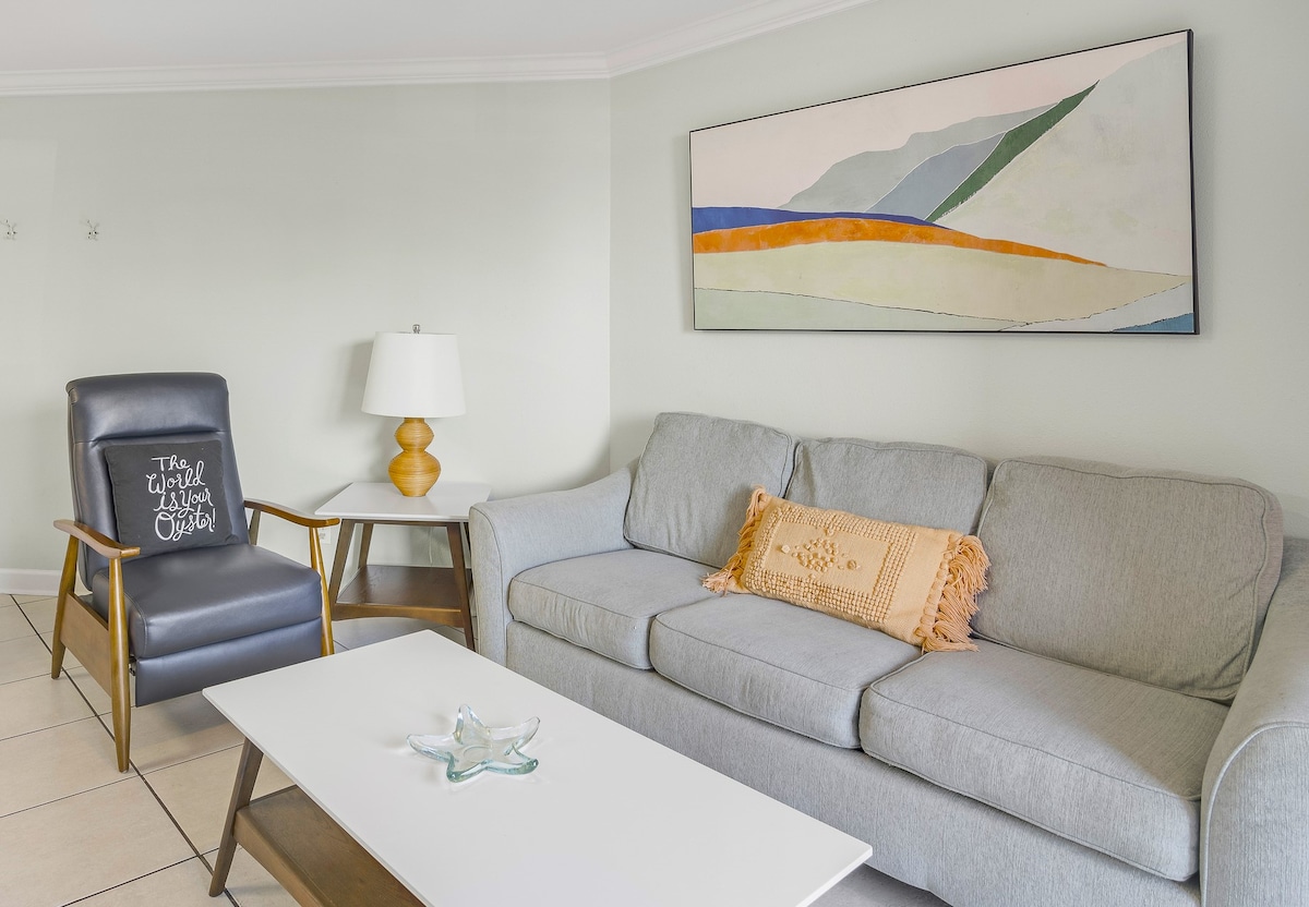 Spacious living space with pull-out Queen bed and 65" smart TV