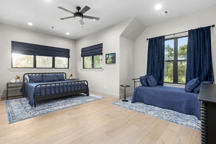 The primary bedroom in the Alexander Suite has a king sized bed as well as a day bed.  All beds have luxury linens, quilts and blankets.