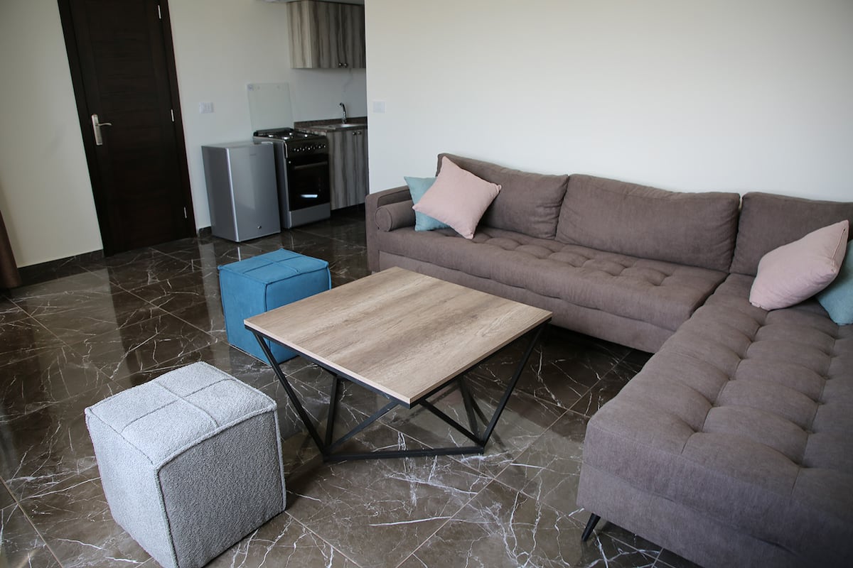 The separate living area inside two-room Chalet 208