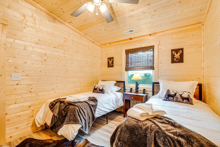 Relax in Bedroom 3, which includes two twin beds, perfect for children, friends, or flexible sleeping arrangements.