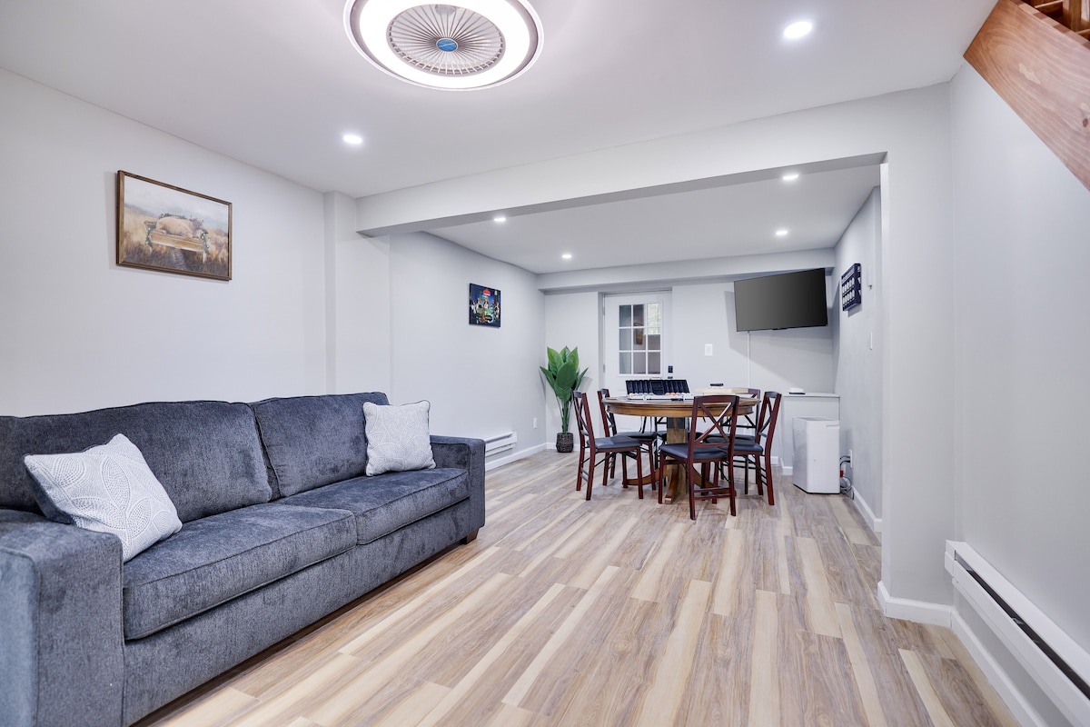 LOWER LEVEL 
The couch opens up to a queen-sized bed. includes a poker table with chipset and cards included (please bring your cards if you want a new deck)