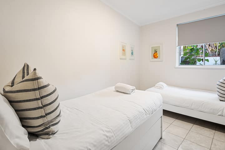 Cosy and cool—the twin room is perfect for kids or friends, complete with air conditioning and thoughtful styling.