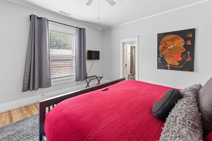 Master bedroom with king size bed and Roku Smart TV