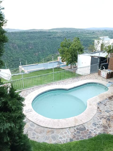 Terrace with 2 pools and villas