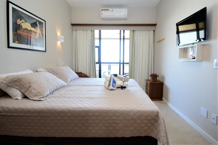 Room with king size bed, 2 retractable single beds, split air conditioning, ceiling fan, smart TV, blackout curtain,  bedding, closets, hangers
